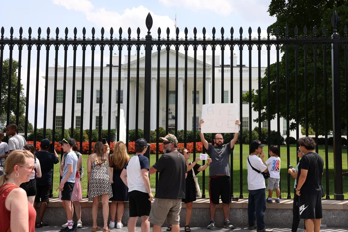 People gather outside the White House after US President Joe Biden announced he is stopping his bid for reelection, on July 21, 2024.