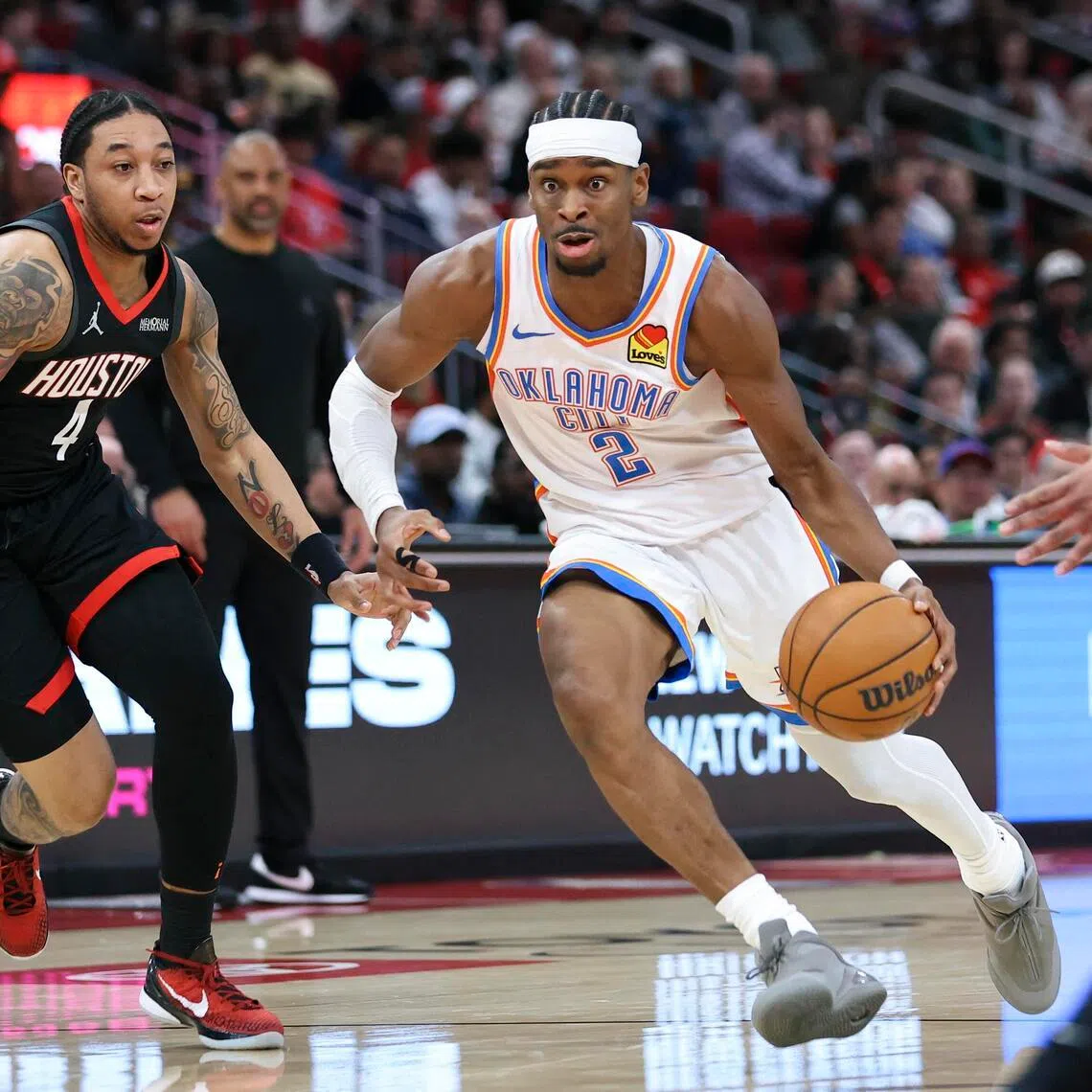 Oklahoma City Thunder guard Shai Gilgeous-Alexander dribbles the ball as Houston Rockets guard JD Davison defends during the third quarter at Toyota Center on Jan 15.