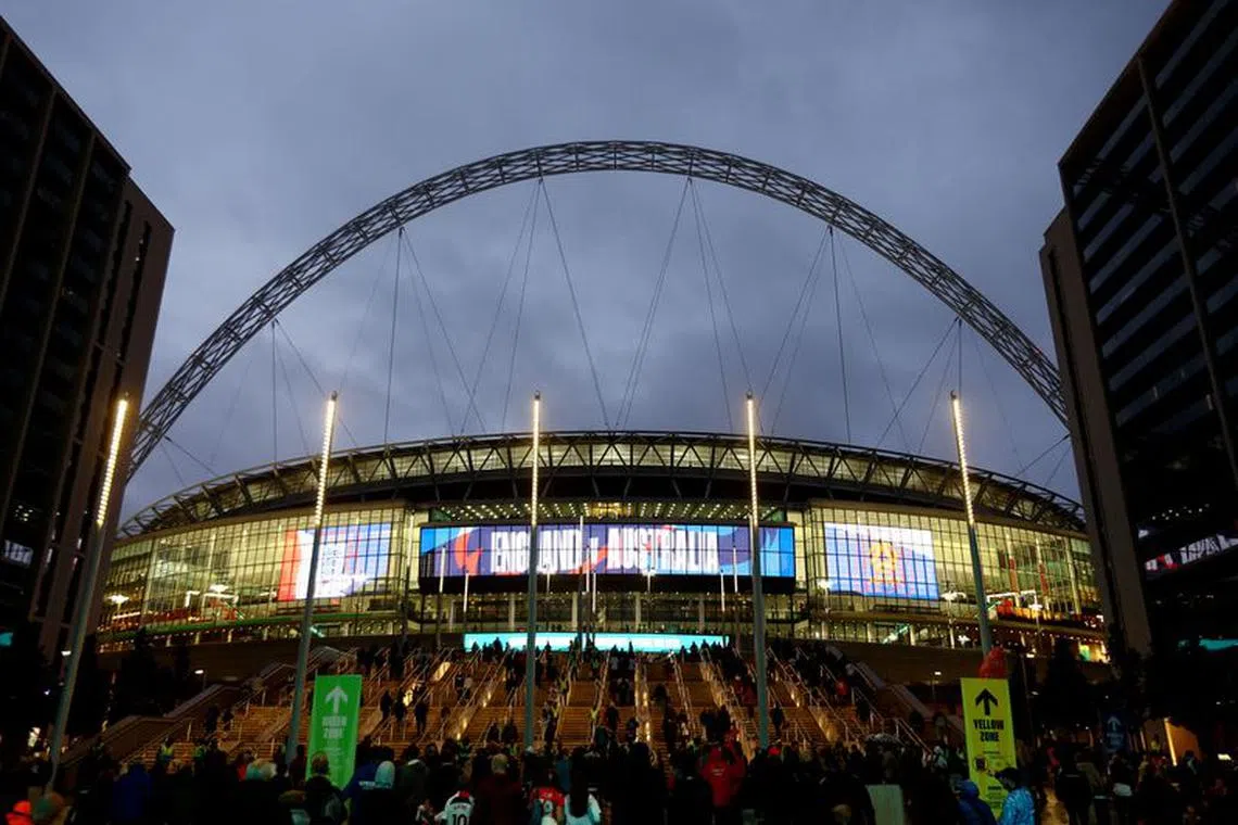 Soccer Football - International Friendly - England v Australia - Wembley Stadium, London, Britain - October 13, 2023 General view of Wembley stadium and the arch as fans arrive outside the stadium before the match Action Images via Reuters/Matthew Childs