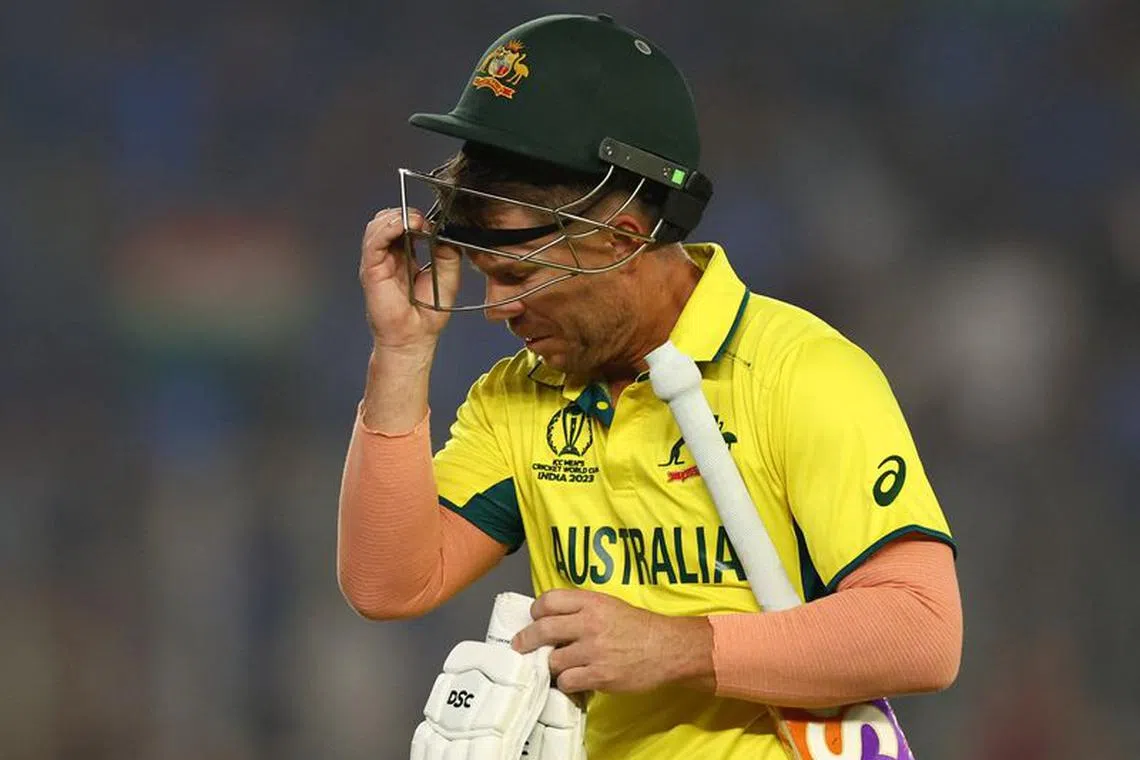 Cricket - ICC Cricket World Cup 2023 - Final - India v Australia - Narendra Modi Stadium, Ahmedabad, India - November 19, 2023 Australia's David Warner walks after losing his wicket, caught out by India's Virat Kohli off the bowling of Mohammed Shami REUTERS/Andrew Boyers/File photo