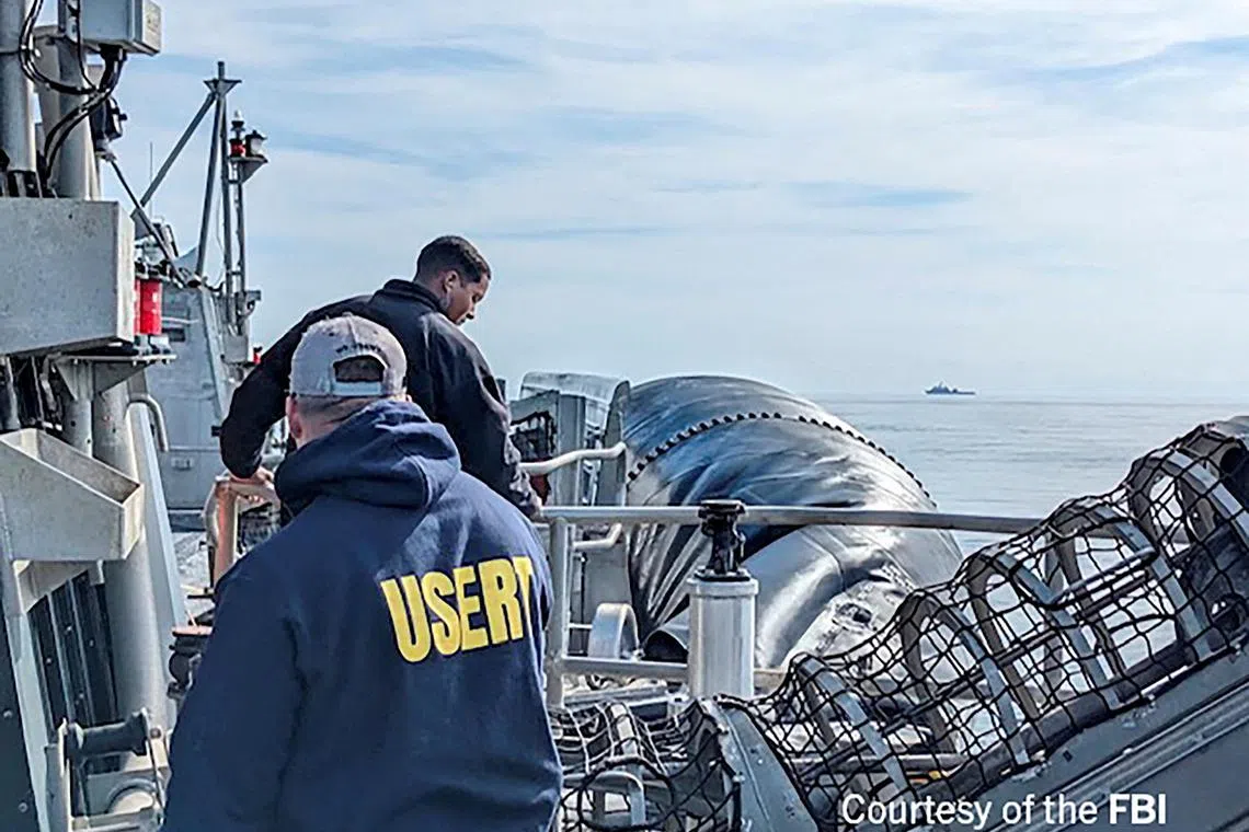 FBI Special Agents getting ready to process material recovered from the high-altitude Chinese balloon that was shot down by a US military jet off the coast of South Carolina.