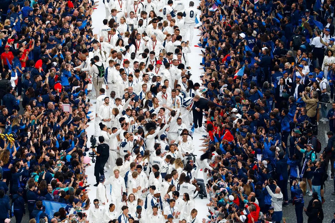 French athletes who took part in the 2024 Olympics and Paralympics walking along a catwalk on Paris' Champs-Elysees avenue, on Sept 14.