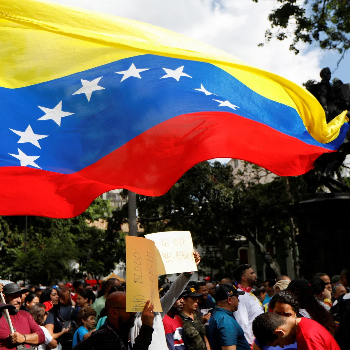 FILE PHOTO: Government supporters participate in a protest against  U.S. President Donald Trump's order to blockade sanctioned oil tankers entering and leaving Venezuela, in Caracas, Venezuela December 17, 2025. REUTERS/File Photo