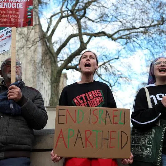 Pro-Palestinian activists protesting against Israel's new death penalty law for Palestinians convicted by military courts of deadly attacks, in London, Britain, on March 31.