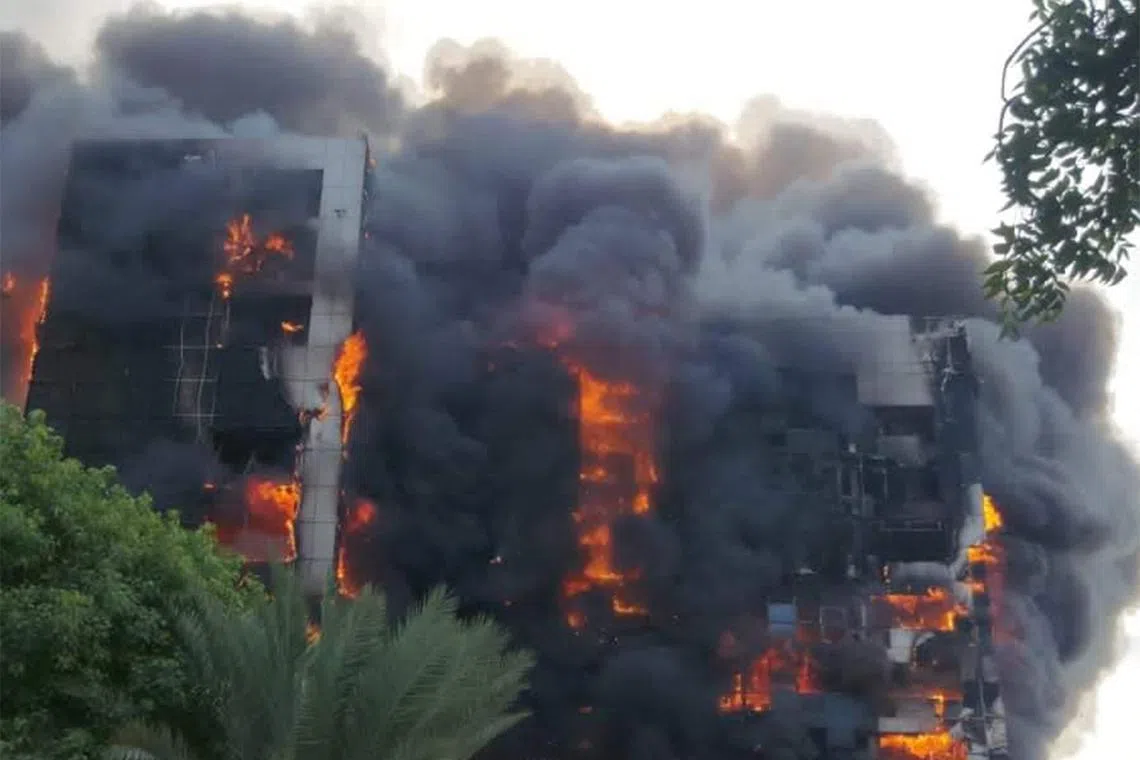 A raging fire is seen at the Greater Nile Petroleum Oil Company Tower in Khartoum.