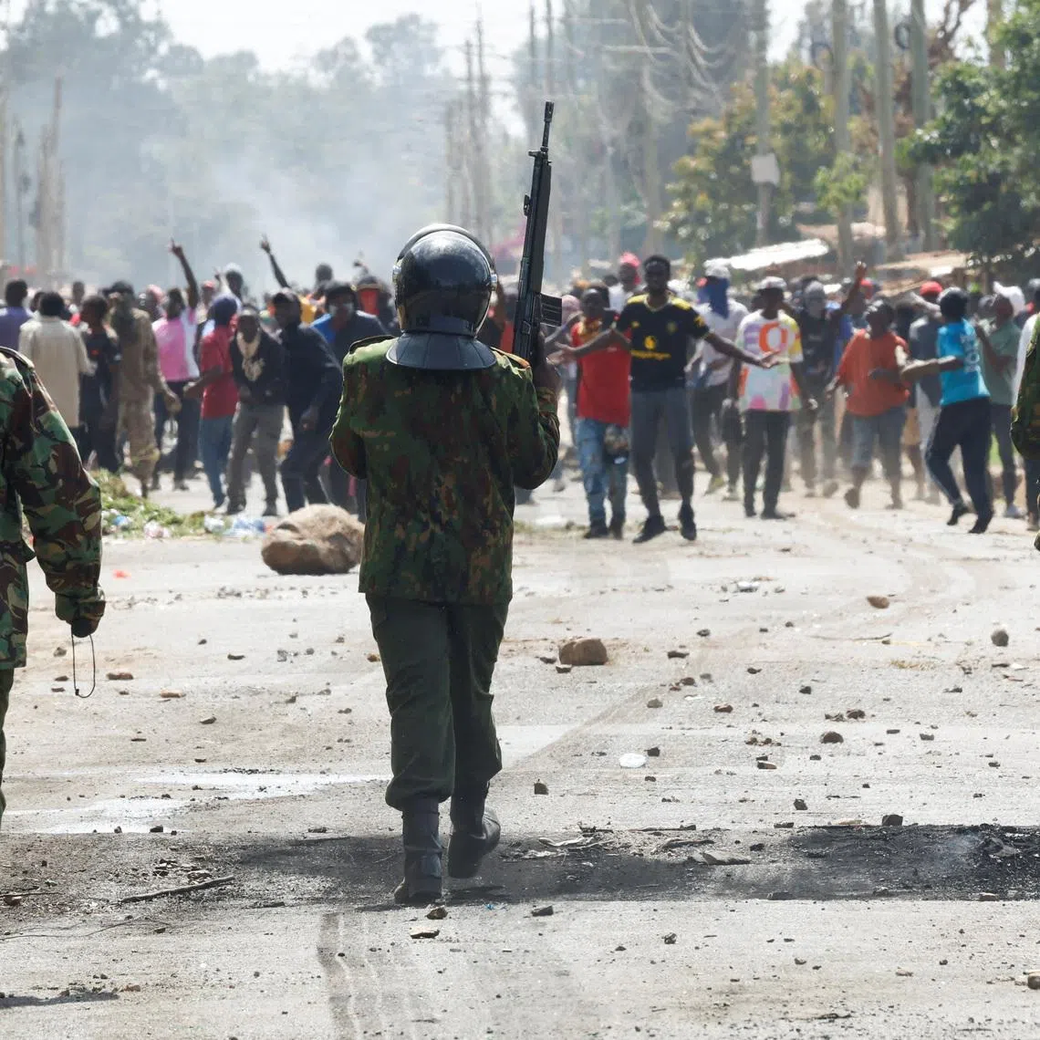 FILE PHOTO: Riot police officers disperse demonstrators in a protest against a U.S.-backed Ebola quarantine plan to establish a 50-bed facility at a Kenyan air force base intended to host Americans exposed to Ebola, in Nanyuki town, Laikipia County, Kenya, June 9, 2026. REUTERS/Monicah Mwangi/File Photo