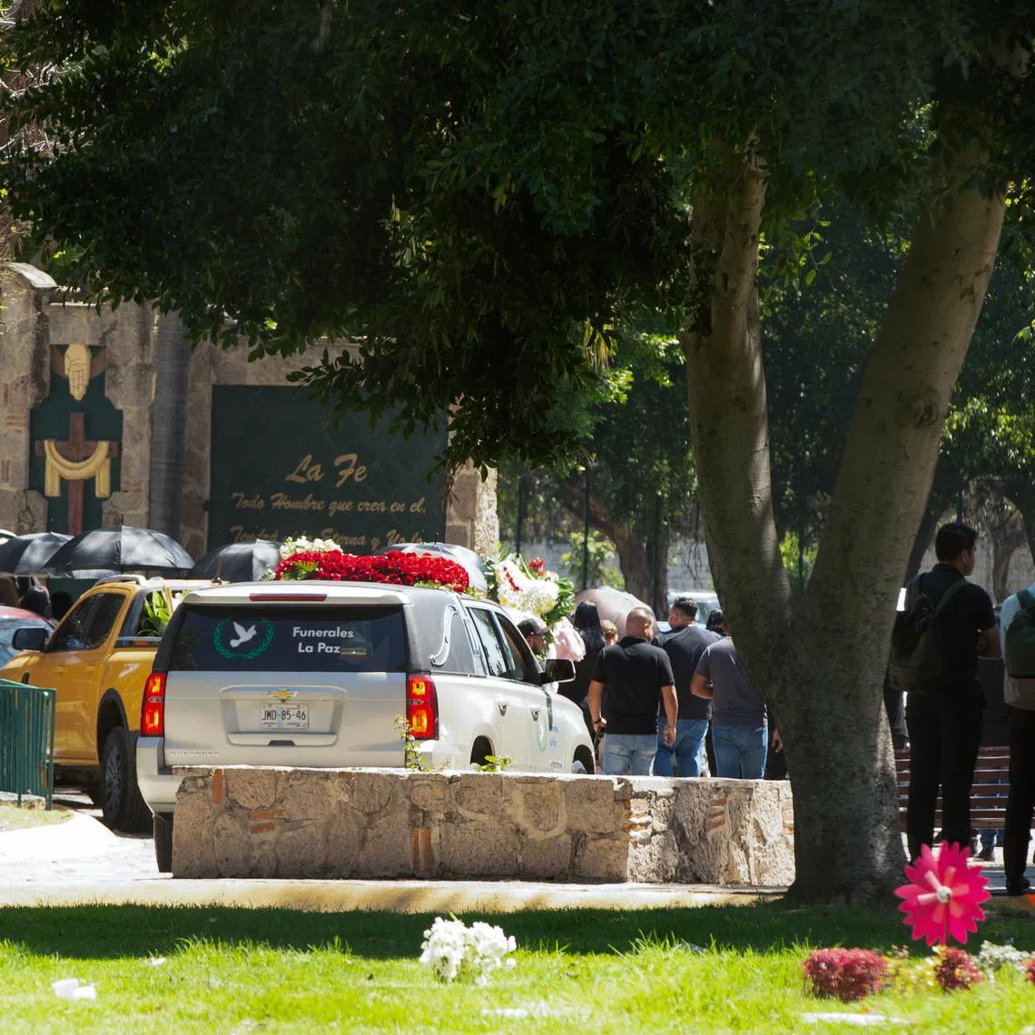 People arrive to the Recinto de la Paz cemetery, where, according to local media, the body of cartel leader Nemesio Oseguera Cervantes, known as “El Mencho,” who was killed on February 22 in a military operation in the state of Jalisco, was brought following his wake, in Zapopan, Mexico, March 2, 2026. REUTERS/Stringer