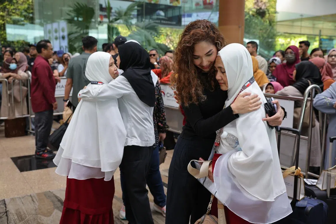 Relatives and friends at Changi Airport sending off the haj pilgrims.