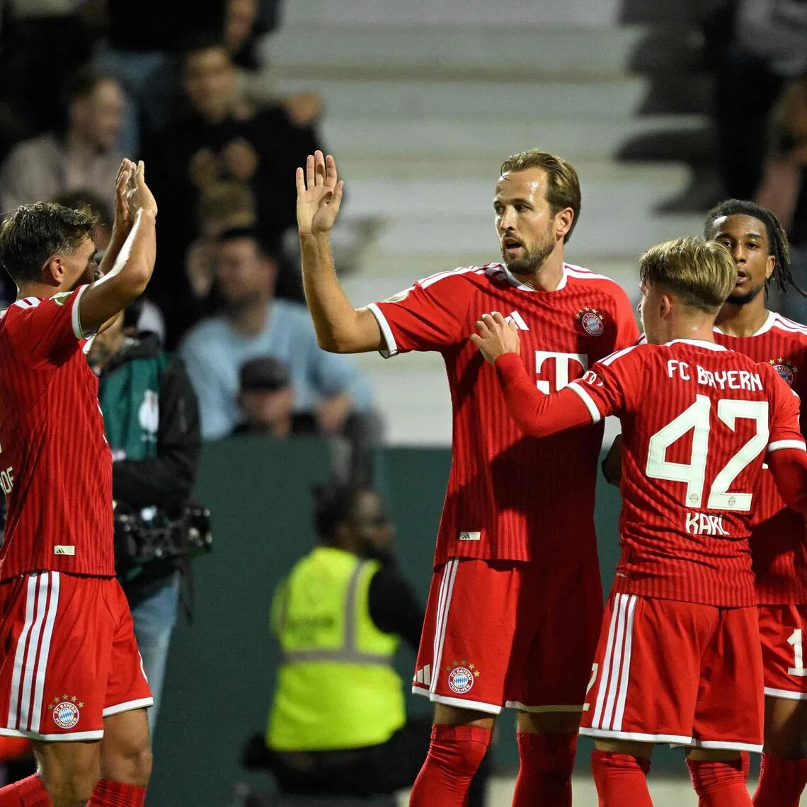 Bayern Munich’s Harry Kane (second from left) celebrating with teammates after Michael Olise (second from right) scored in a 4-1 win over VfL Osnabruck on Sept 2.