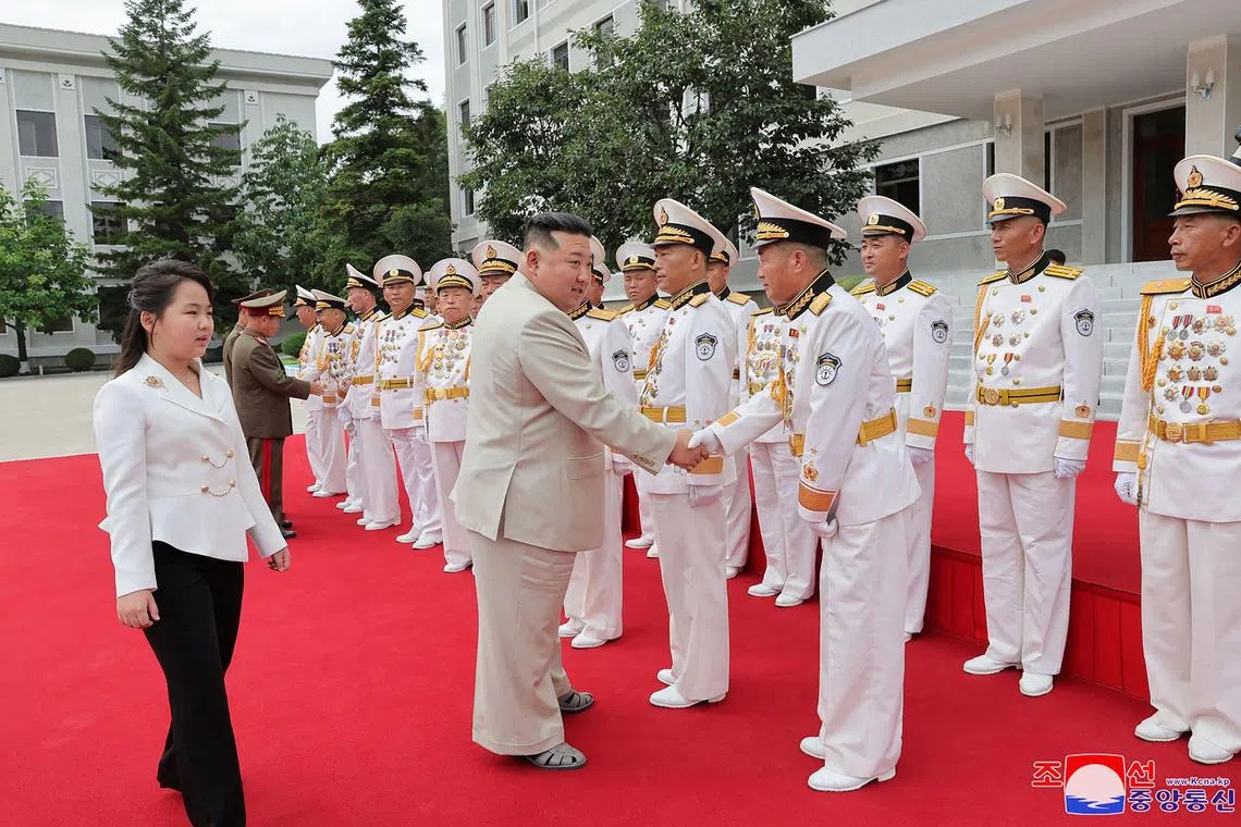 North Korea's Kim Jong Un being accompanied by his daughter Kim Ju Ae as he visits the Naval Command of the Korean People's Army.