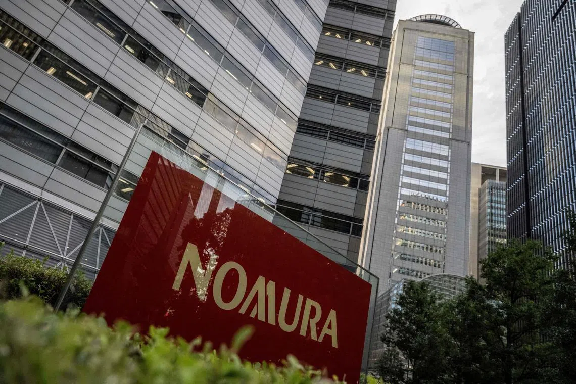 Signage outside the Tokyo headquarters of Japanese company Nomura Securities is pictured in Tokyo on October 30, 2024. Nomura Securities is expected to announce their quarterly earnings on November 1. (Photo by Yuichi YAMAZAKI / AFP)