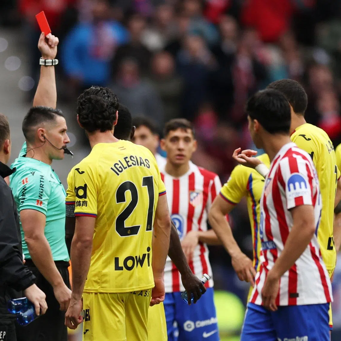 Soccer Football - LaLiga - Atletico Madrid v Getafe - Riyadh Air Metropolitano, Madrid, Spain - March 14, 2026 Referee Miguel Angel Ortiz Arias shows a red card to Getafe's Abdel Abqar after a VAR review REUTERS/Violeta Santos Moura