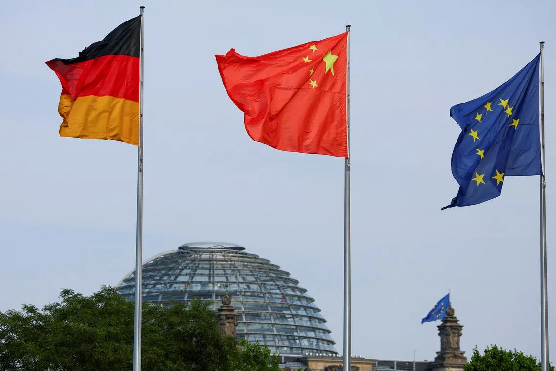 FILE PHOTO: The flags of Germany, China and the European Union are seen ahead of a meeting between German Chancellor Olaf Scholz and Chinese Premier Li Qiang in Berlin, Germany, June 19, 2023. REUTERS/Fabrizio Bensch/File Photo
