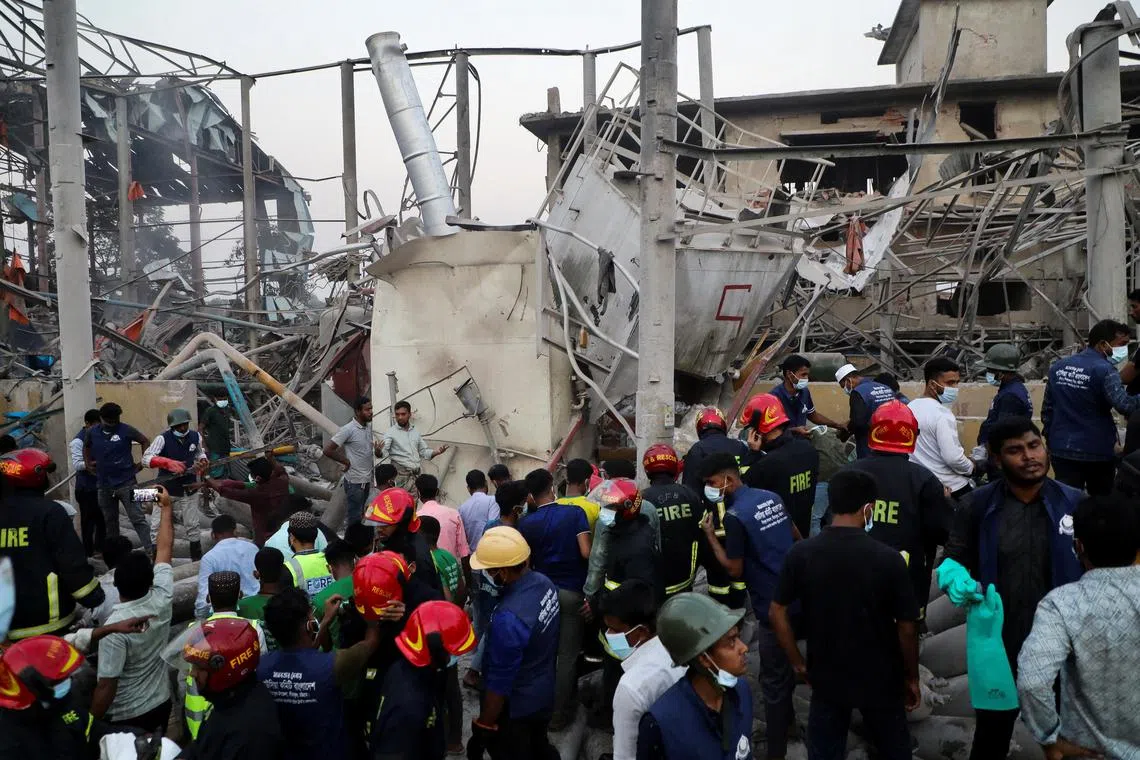 Firefighters and rescue workers gather at an oxygen plant that exploded on the outskirts of Chittagong, Bangladesh, on March 4, 2023. 
