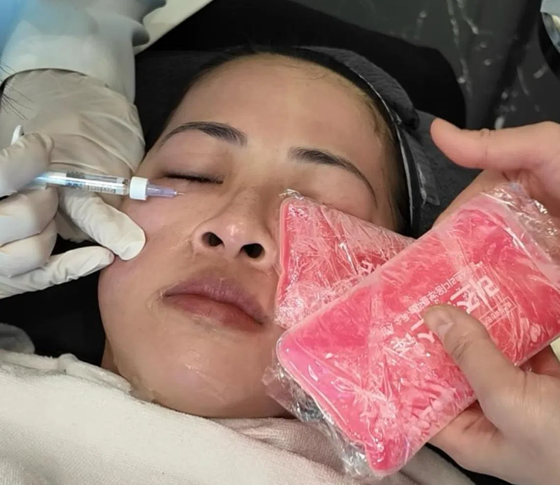 Ms Caitlin Lim getting fillers injected in her under-eye area at a aesthetic clinic. 