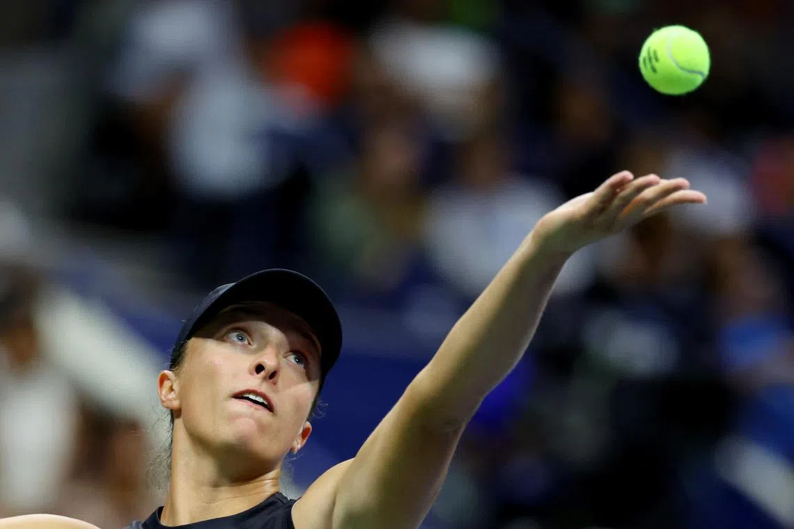 Poland's Iga Swiatek in action during the mixed doubles final with Norway's Casper Ruud against Italy's Sara Errani and Italy's Andrea Vavassori.
