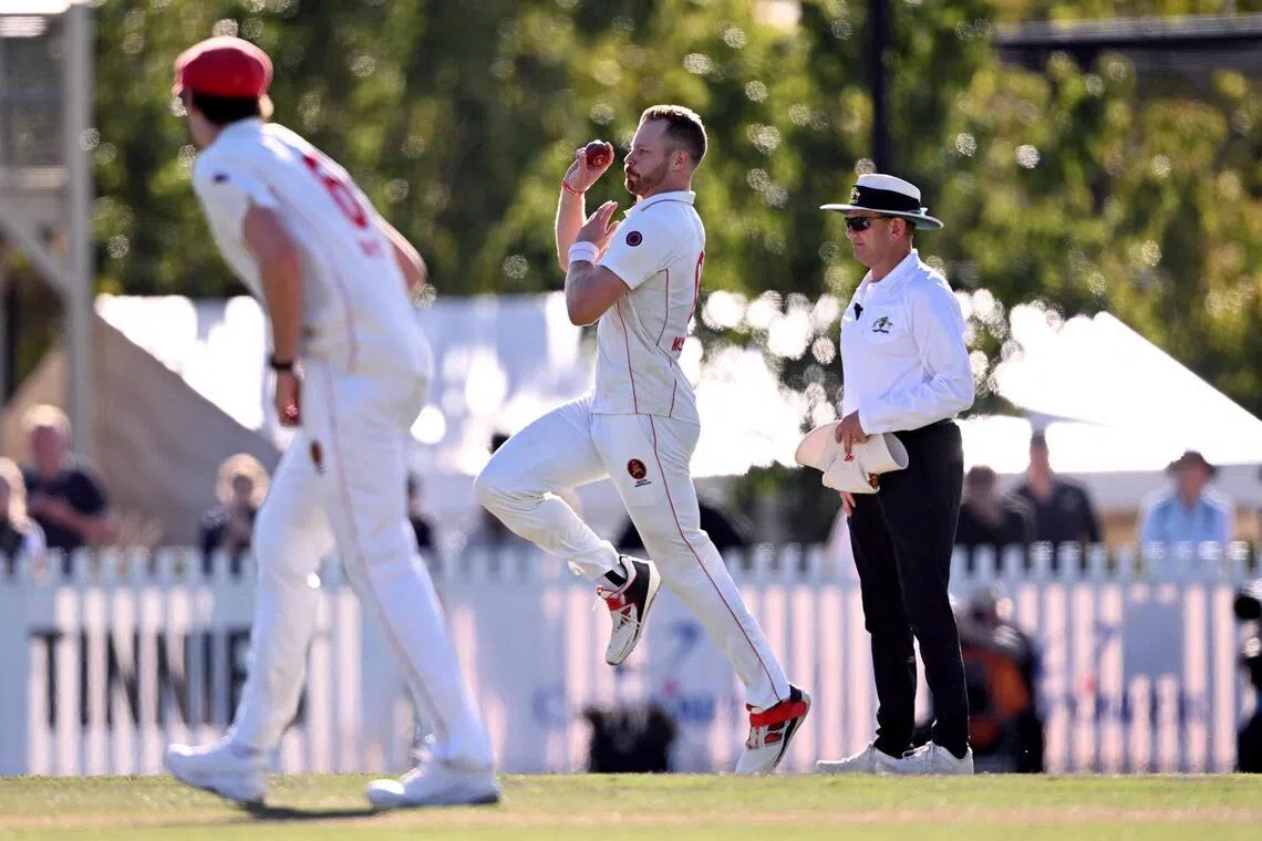 South Australia's Nathan McAndrew bowls on the fourth day of the Sheffield Shield cricket final against Victoria at the Junction Oval in Melbourne on March 29, 2026. They won by 56 runs for a second straight title.