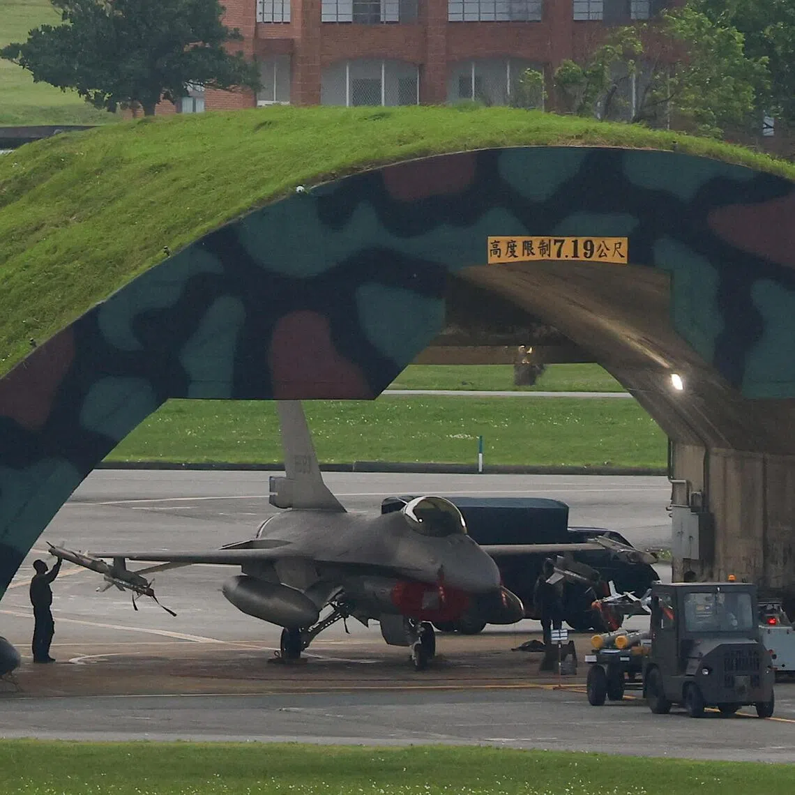 FILE PHOTO: A technician works on an F-16 plane at an air force base in Hualien, Taiwan April 8, 2023. REUTERS/Ann Wang/File Photo