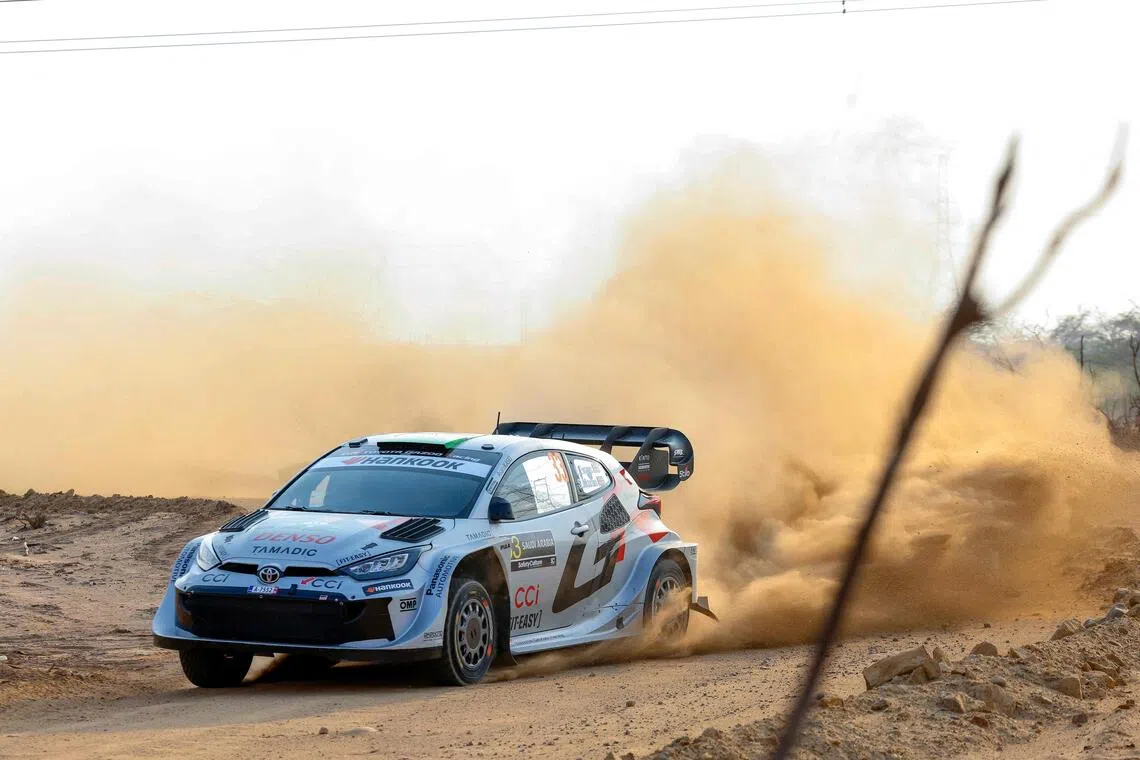 Toyota Gazoo Racing WRT Team's British driver Elfyn Evans and co-driver Scott Martin in their Toyota GR Yaris Rally 1 during the second stage of the FIA World Rally Championship (WRC) in Jeddah on Nov 27, 2025.