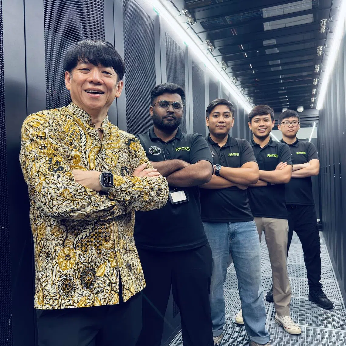 Racks Central's chief executive and founder Bobby Wee (far left) with the data centre operator's engineers in its Tai Seng facility.