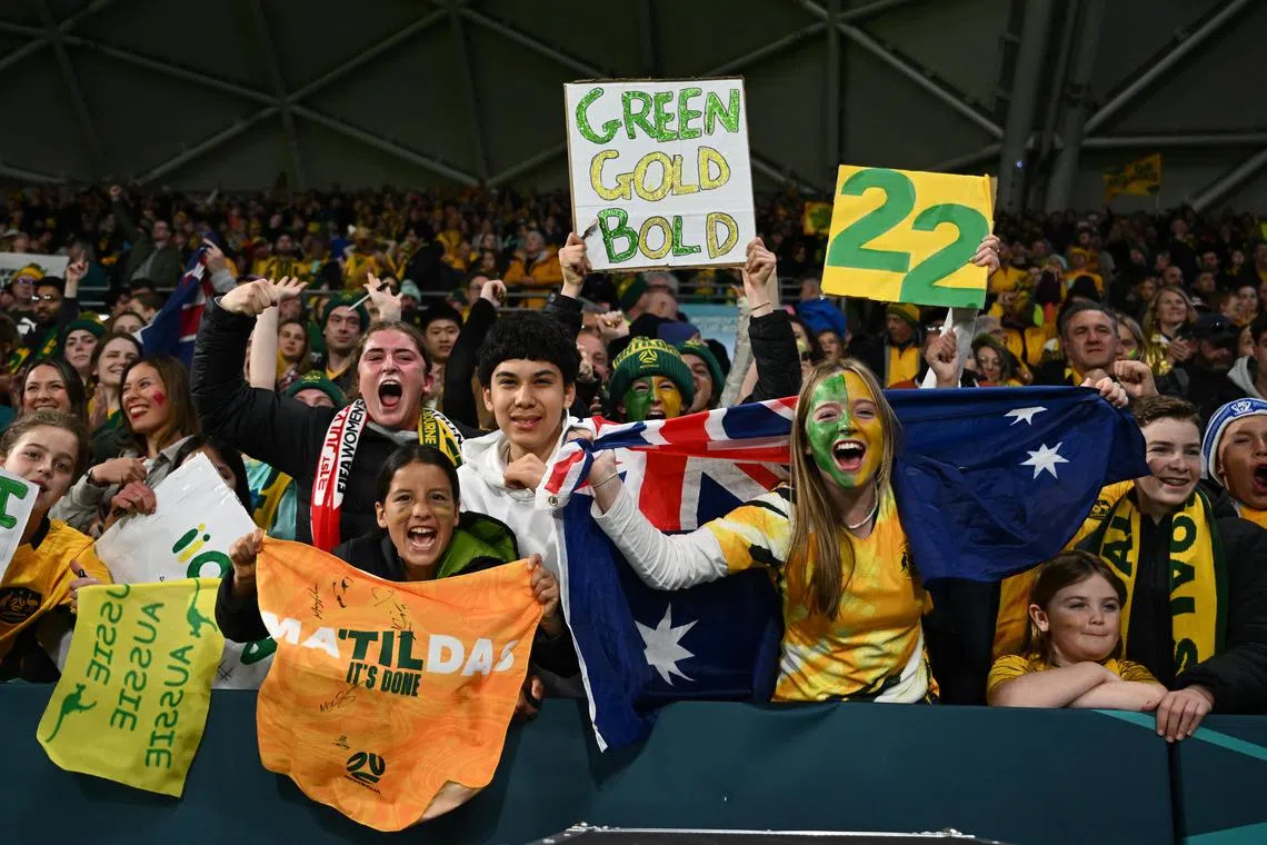 Australian fans celebrate the team's Women's World Cup win over Canada.