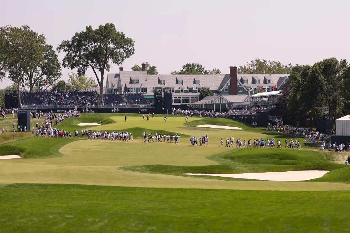 Jun 11, 2025; Oakmont, Pennsylvania, USA; General view of the on the 18th green in front of the clubhouse during a practice round for the U.S. Open golf tournament at Oakmont Country Club. Mandatory Credit: Bill Streicher-Imagn Images