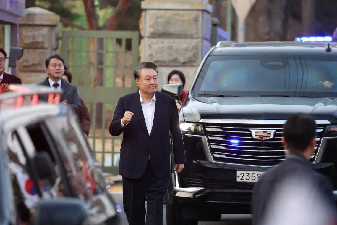 South Korean impeached President Yoon Suk Yeol reacts outside the Seoul detention center after his release, in Uiwang, South Korea, March 8, 2025. REUTERS/Kim Hong-ji