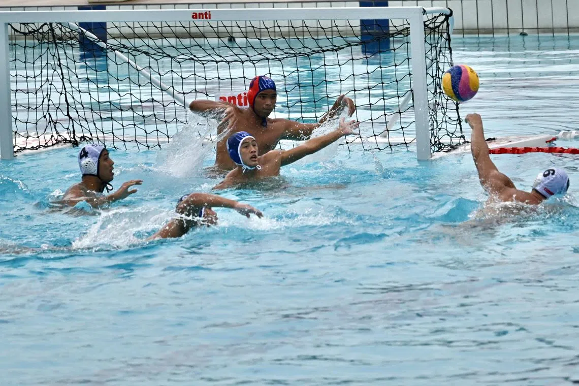 SEA Games 2023 Water Polo match between Singapore and Thailand on 12 May 2023.
Coverage of the Cambodia 2023 Southeast Asian Games on 12 May 2023.

Singapore's Paul Tan (white cap No. 6) scores in the 12-7 win over Thailand, with 