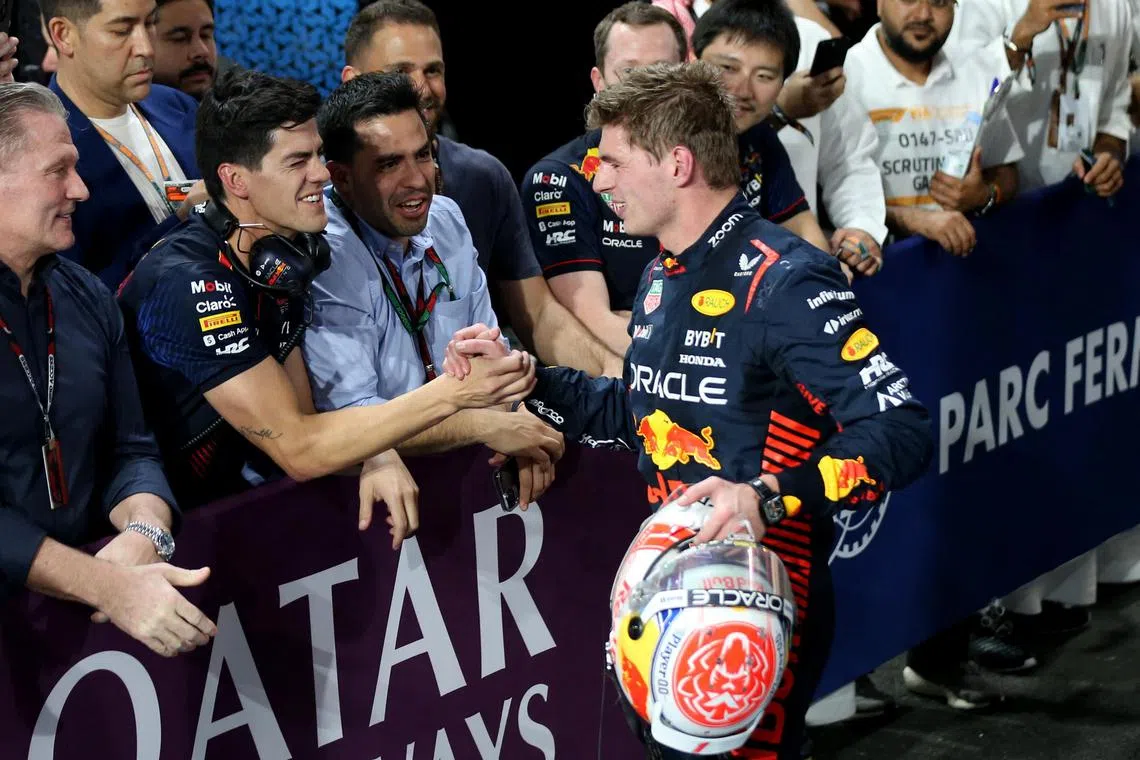 Red Bull's Max Verstappen celebrates with his team after finishing second place in the Saudi Arabian Grand Prix.