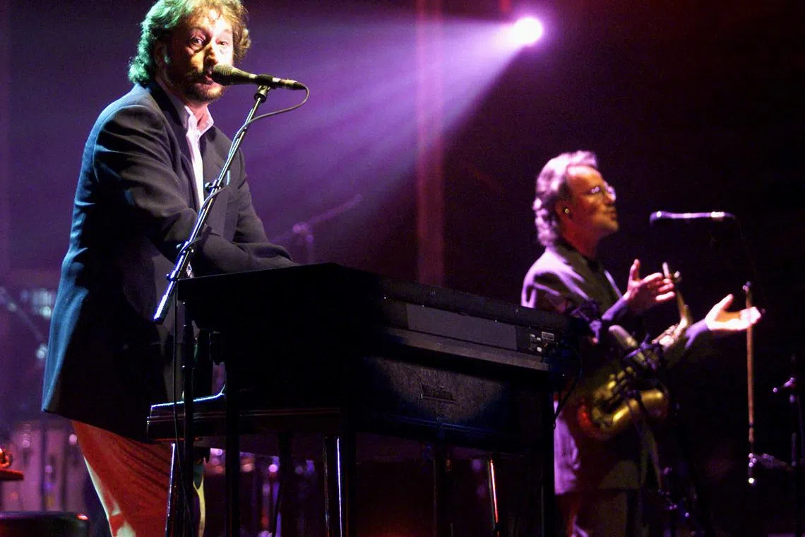 FILE PHOTO: Supertramp rock group member Rick Davis, (L), vocals and keyboards, and John Helliweil,(R) sax, both founding members of Supertramp, perform during their first concert of the 2002 world tour \" One More for the Road\" in Benidorm, Spain April 18, 2002. REUTERS/Heino Kalis  PH/File Photo