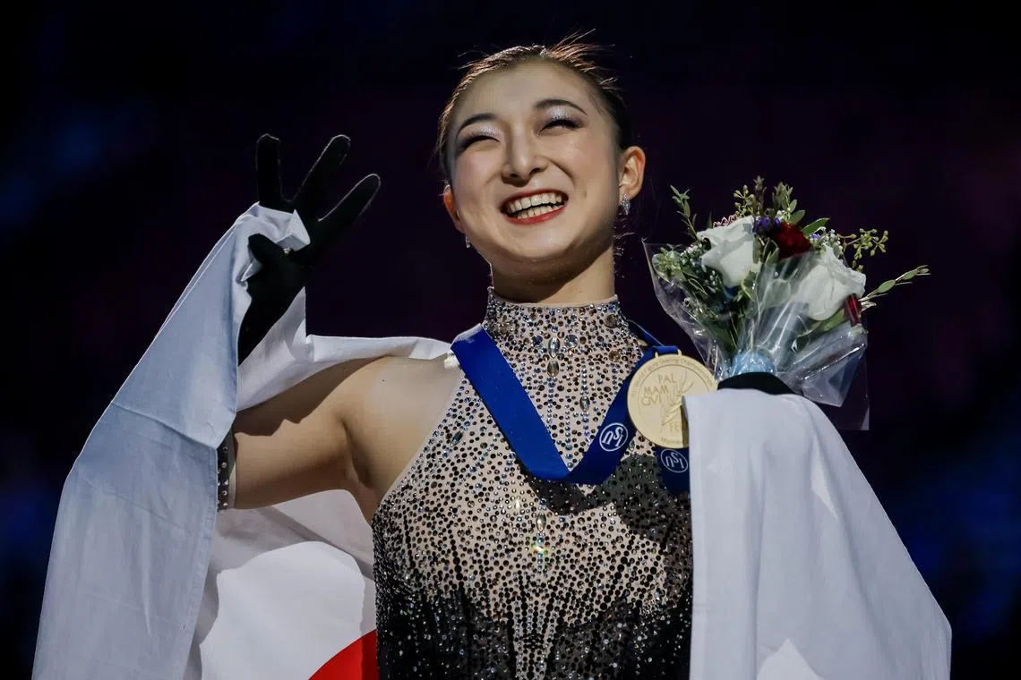 Gold medalist Kaori Sakamoto of Japan is all smiles after the medals ceremony at the Figure Skating World Championships in Montreal.