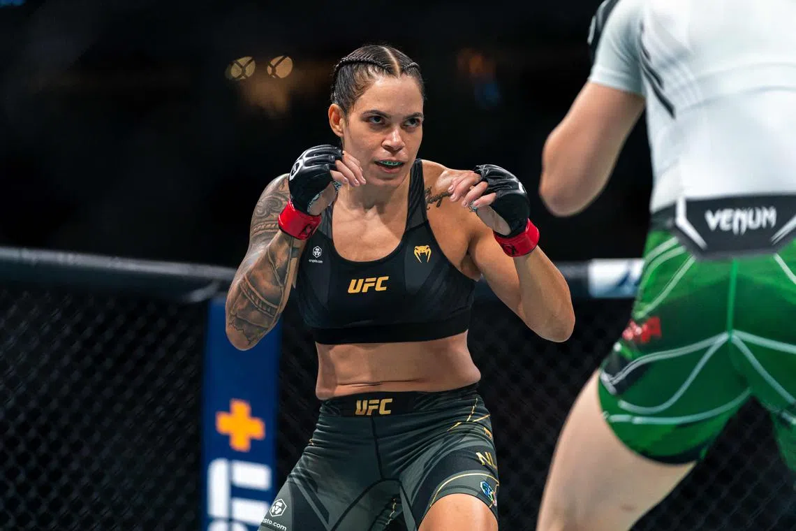 Amanda Nunes sizes up Irene Aldana during the UFC 289 event at Rogers Arena on June 10 in Vancouver.