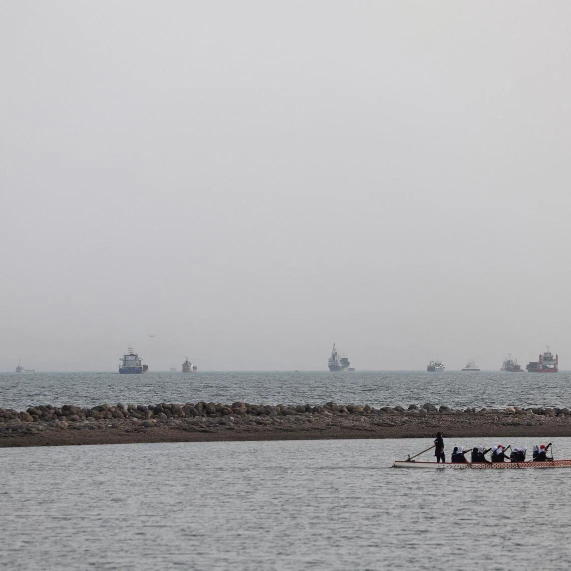 Vessels in the Strait of Hormuz seen from the beach of Iran's Bandar Abbas. The military site that was struck was an Iranian ground control station in Bandar Abbas that was about to launch a fifth drone.