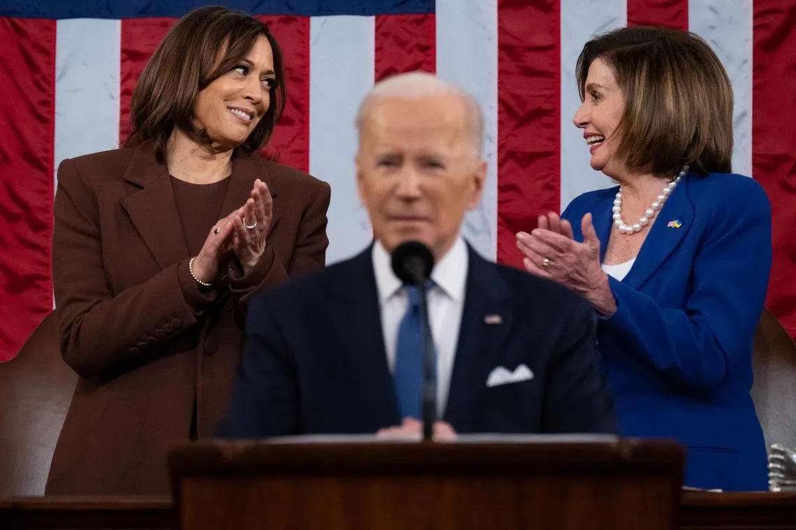US Vice-President Kamala Harris (left) and US House Speaker Nancy Pelosi (right) applaud as US President Joe Biden delivers his first State of the Union address. 