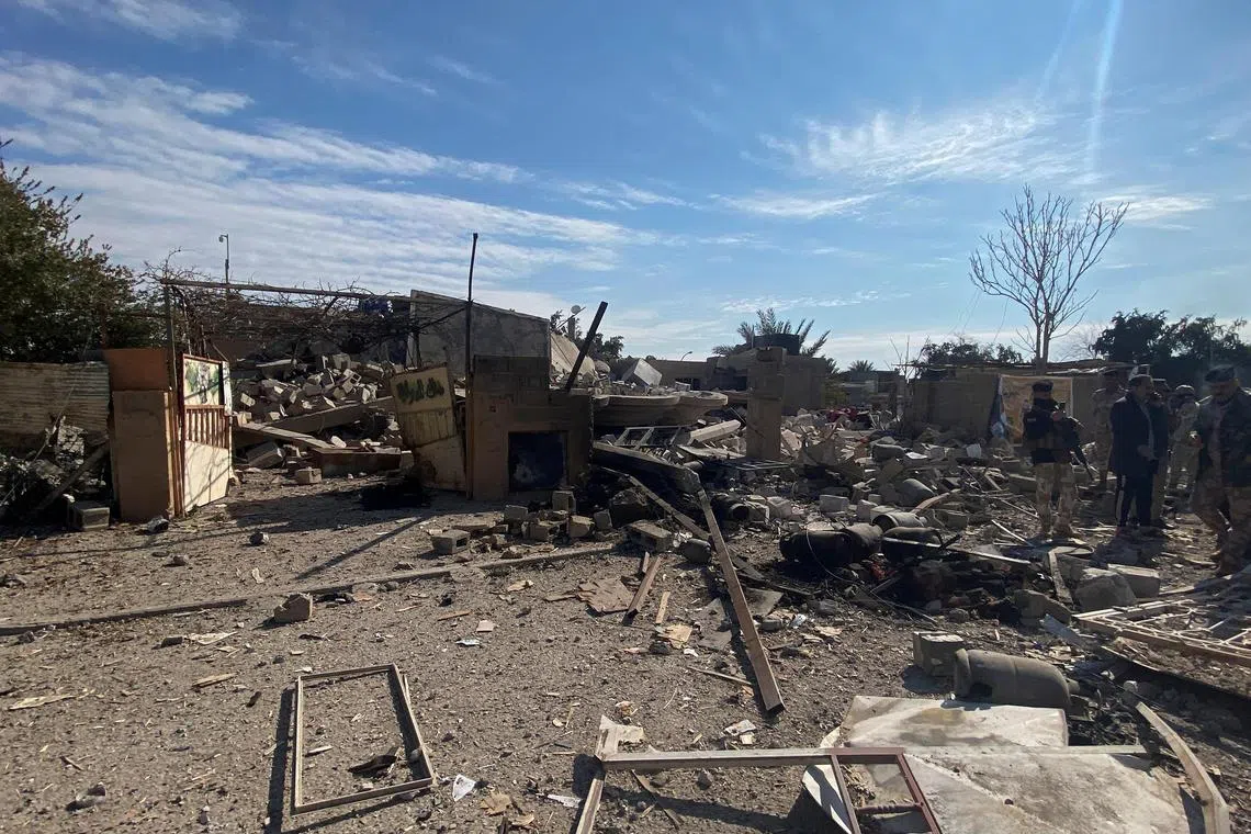 A destroyed building is pictured at the site of a US airstrike in al-Qaim, Iraq, on Feb 3, 2024.