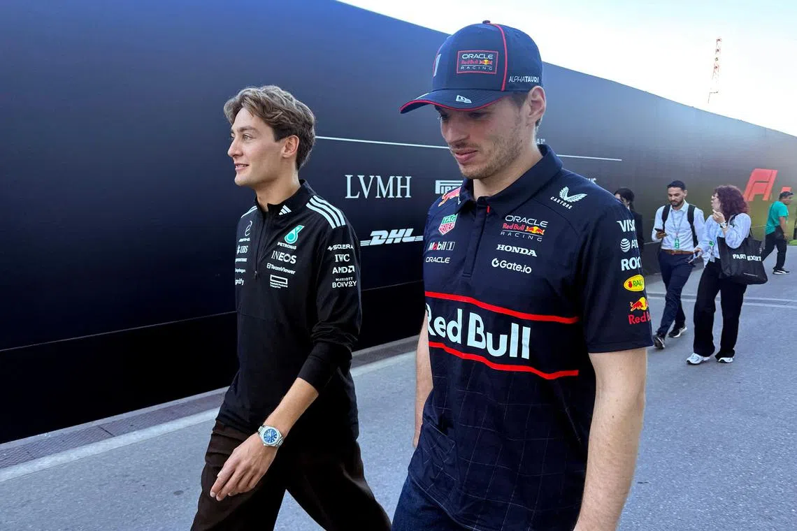 George Russell (left) has suggested his contract renewal is being held up over Mercedes' ongoing interest in Red Bull driver Max Verstappen.