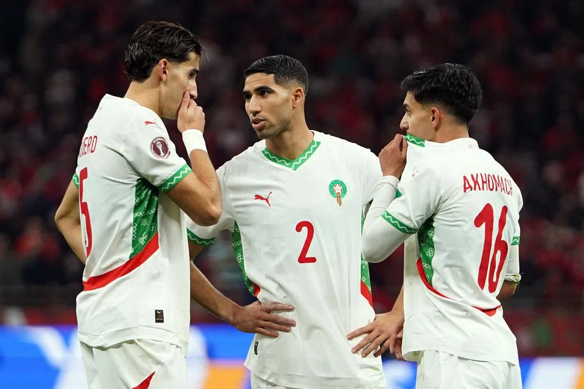 Soccer Football - CAF Africa Cup of Nations - Morocco 2025 - Group A - Zambia v Morocco - Prince Moulay Abdellah Stadium, Rabat, Morocco - December 29, 2025 Morocco's Achraf Hakimi with teammates REUTERS/Stringer