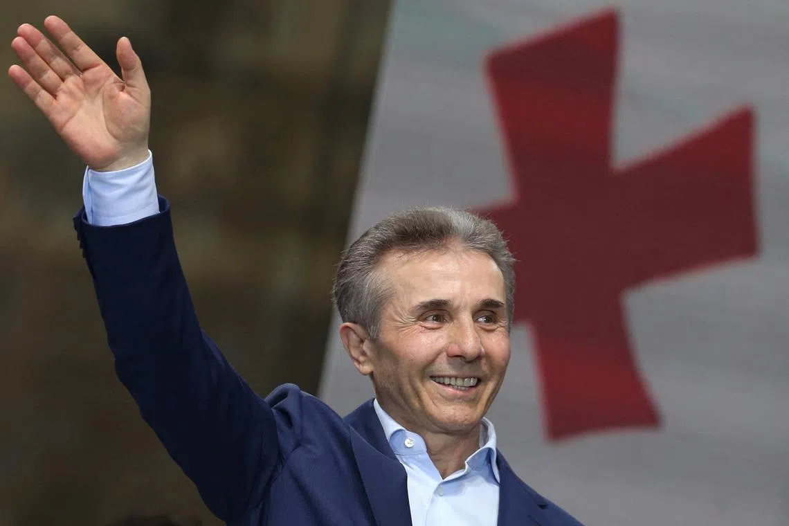 FILE PHOTO: Bidzina Ivanishvili, former prime minister and founder of the Georgian Dream party, waves during a pro-government rally in support of a bill on \"foreign agents\" in Tbilisi, Georgia April 29, 2024. REUTERS/Irakli Gedenidze/File Photo