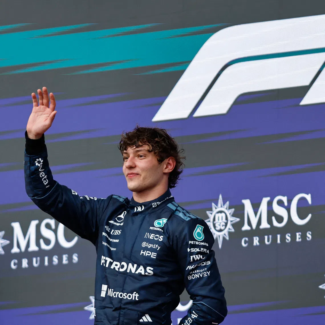 Mercedes’ Kimi Antonelli celebrates on the podium after winning the United States Grand Prix.