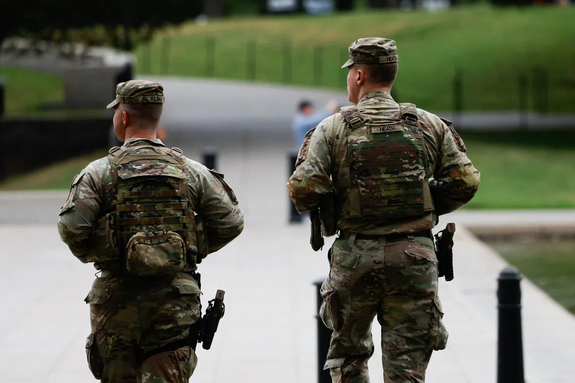 Members of the Ohio National Guard patrol the National Mall, weeks after US President Donald Trump ordered an increased presence of federal law enforcement to assist in crime prevention.