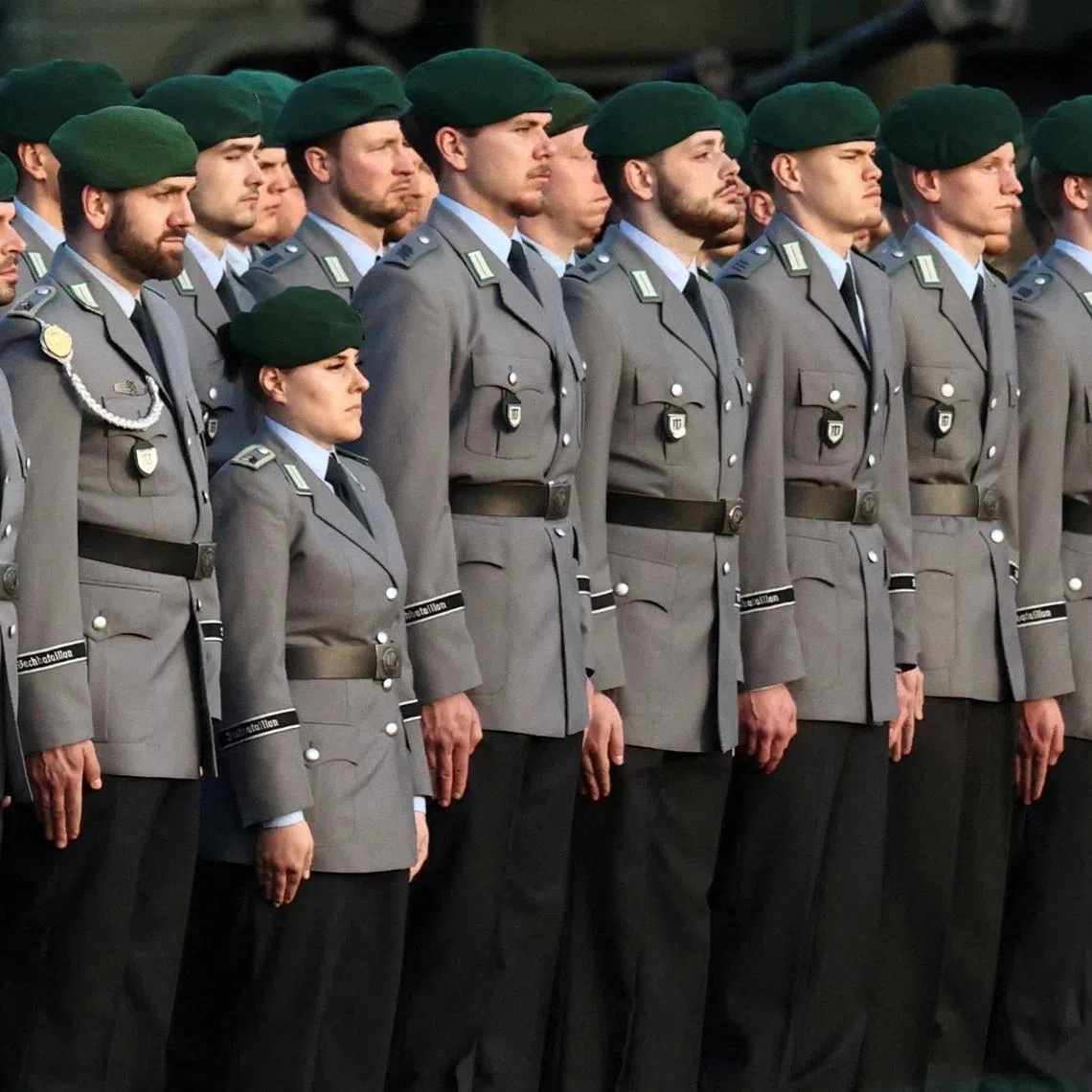 FILE PHOTO: Soldiers of the Guard Battalion of the German army Bundeswehr stand in position on the day German Chancellor Friedrich Merz presents the Chancellor's Ribbon of Honour to the Guard Battalion, which is responsible for protocol duties and the protection of the German government, at the Federal Defence Ministry in Berlin, Germany, March 23, 2026. REUTERS/Liesa Johannssen/File Photo