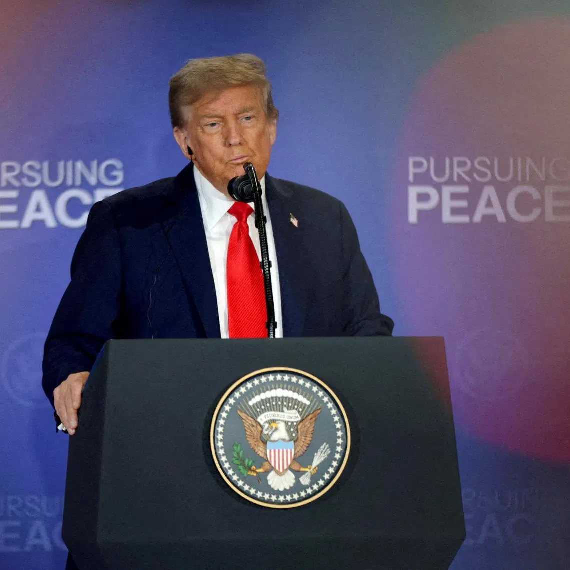 FILE PHOTO: U.S. President Donald Trump holds a press conference with Russian President Vladimir Putin following their meeting to negotiate an end to the war in Ukraine, at Joint Base Elmendorf-Richardson in Anchorage, Alaska, U.S., August 15, 2025. REUTERS/Jeenah Moon/ File Photo