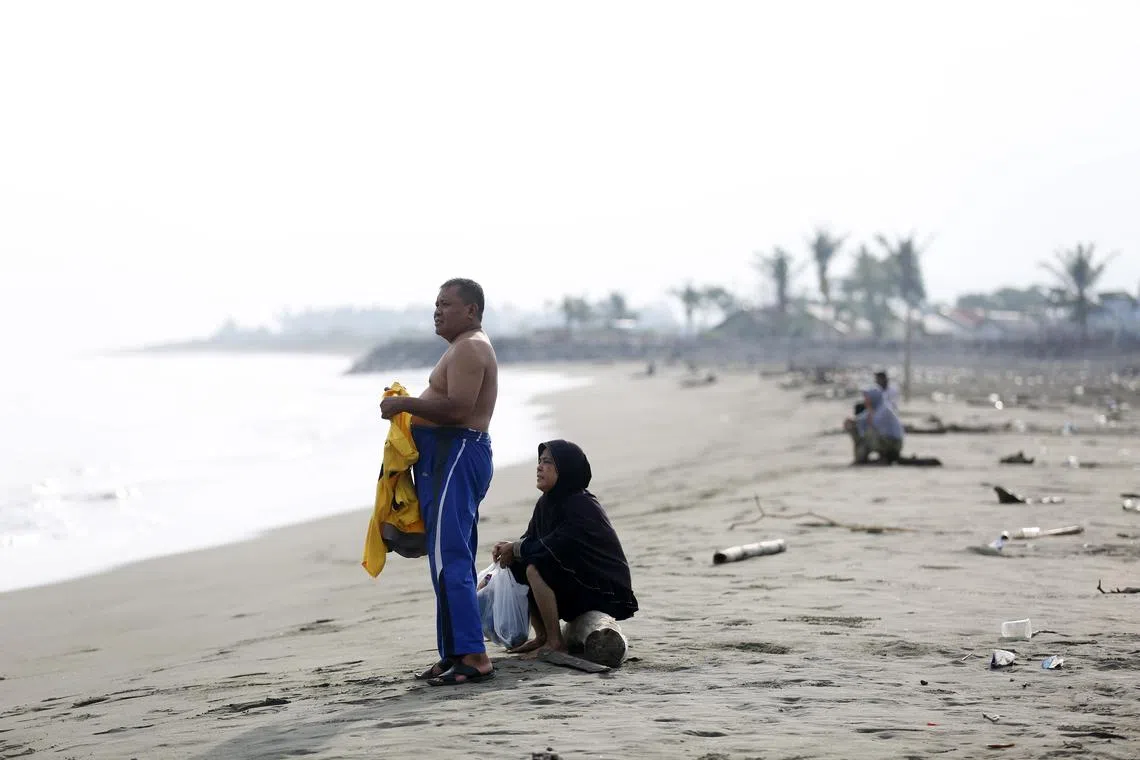 Locals on the shore at Syiah Kuala beach in Banda Aceh, Indonesia on April 30, 2024. 