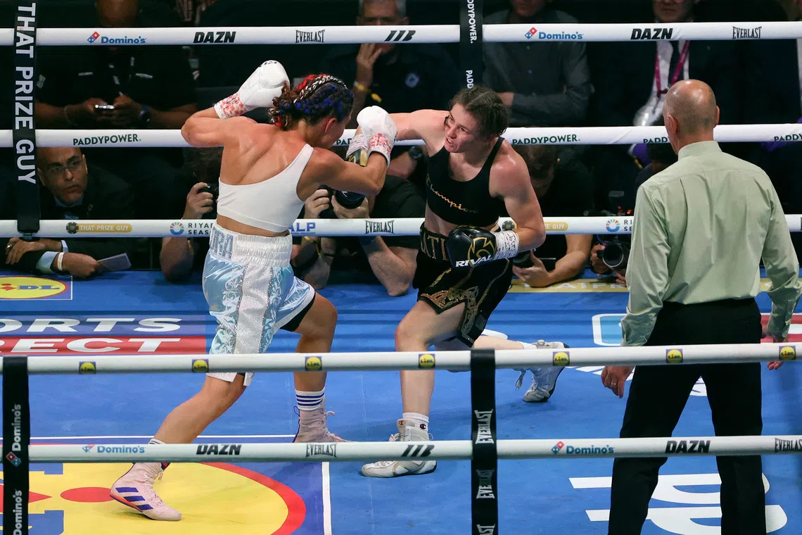 Katie Taylor (in black) en route to a unanimous decision win over France’s Flora Pili on Sept 5.