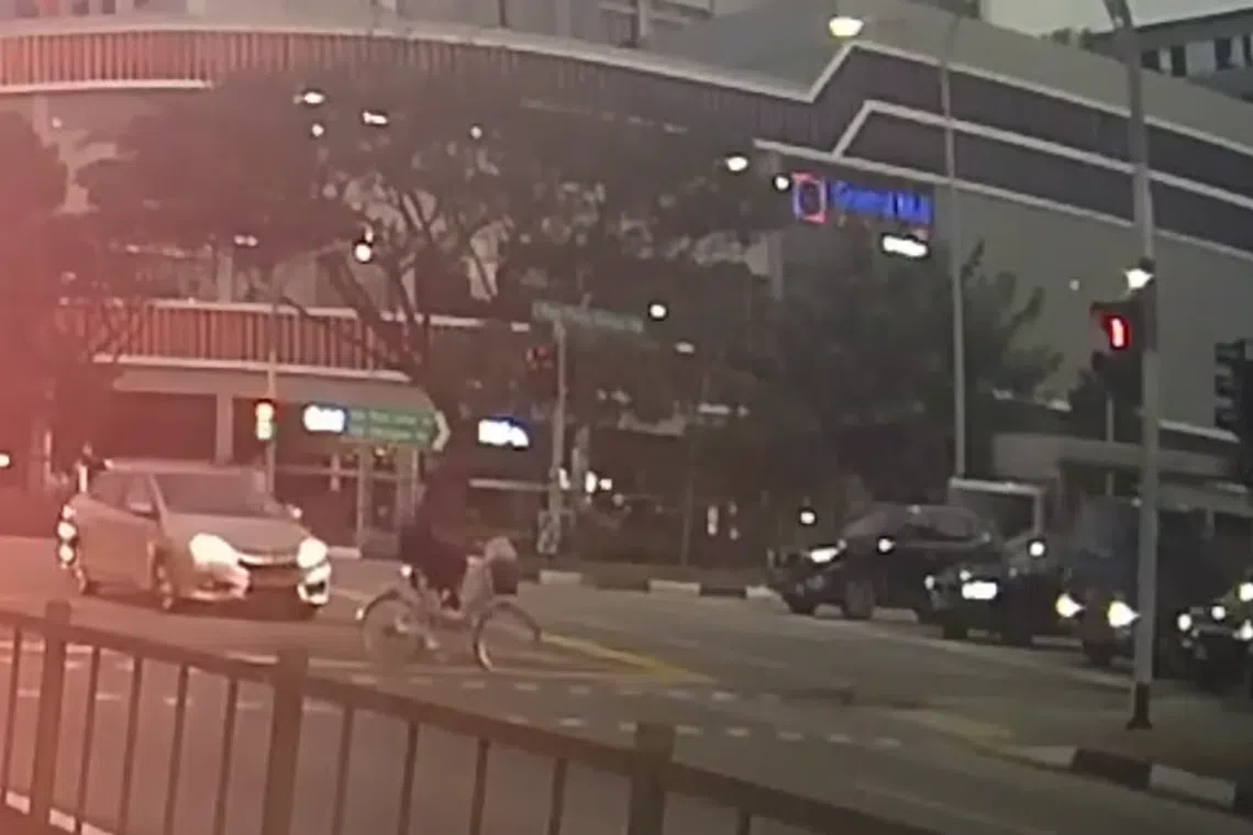 Videos of the incident show a man cycling across the road while the red man pedestrian signal was on. 