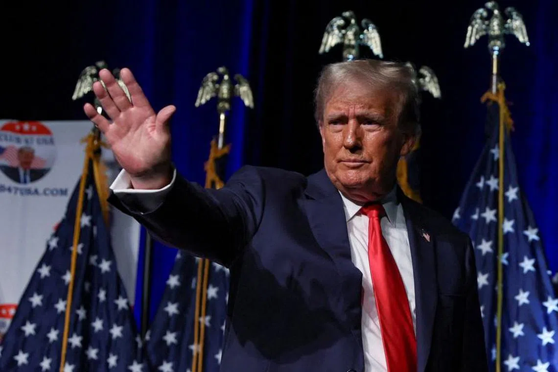 FILE PHOTO: Former U.S. President and Republican presidential candidate Donald Trump waves at the Club 47 USA event in West Palm Beach, Florida, U.S. October 11, 2023. REUTERS/Shannon Stapleton/File Photo
