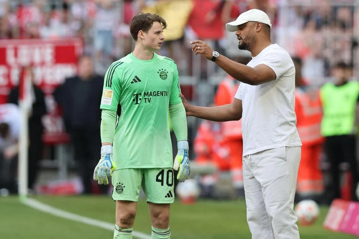 Bayern Munich coach Vincent Kompany giving instructions to his goalkeeper Jonas Urbig during their 3-3 Bundesliga draw with Heidenheim on May 2.