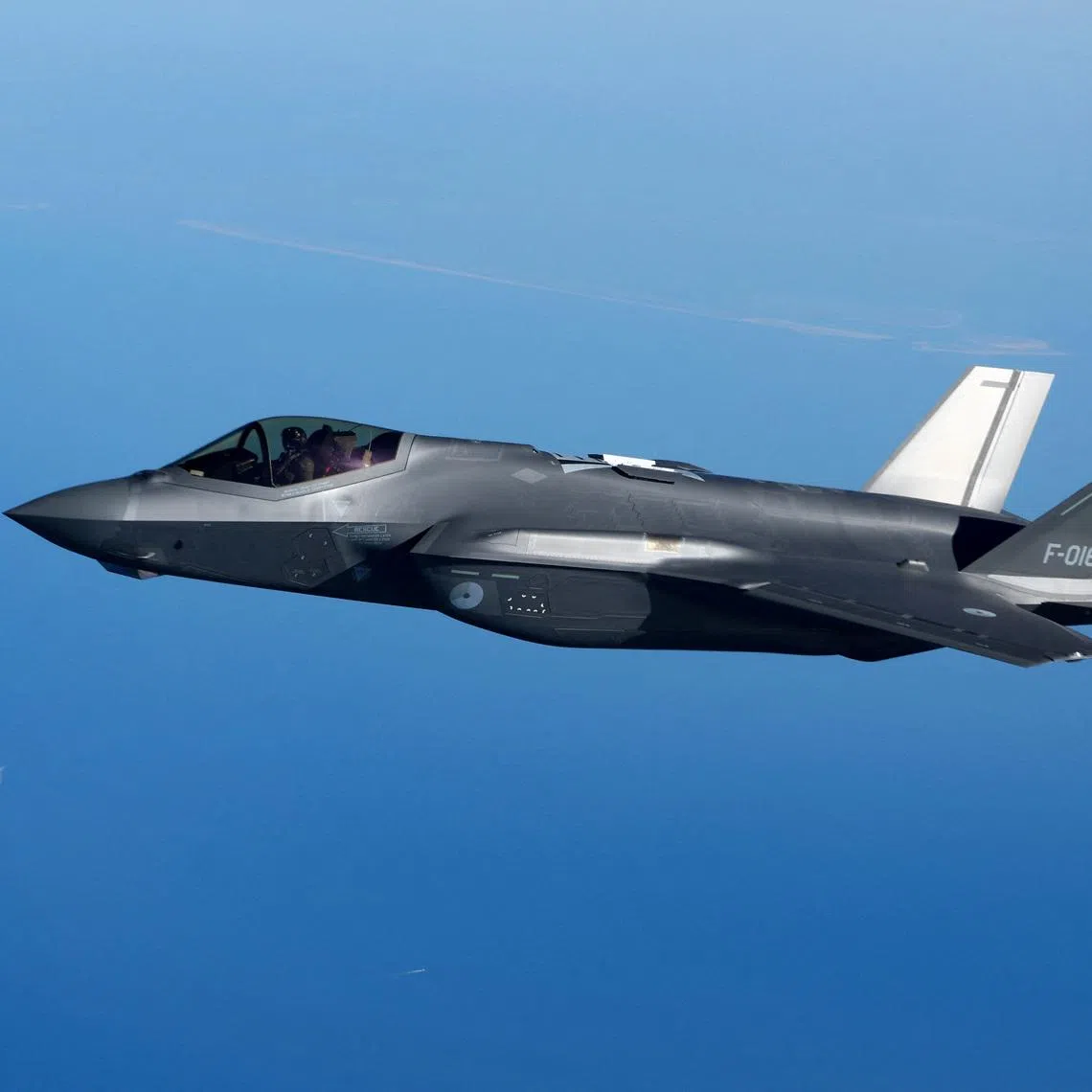 A Dutch F-35 fighter jet is seen after being refuelled by a Multinational MRTT Unit in the air during NATO's Ramstein Flag exercise above Denmark starting from Eindhoven Netherlands, Denmark April 2, 2025. REUTERS/Piroschka van de Wouw