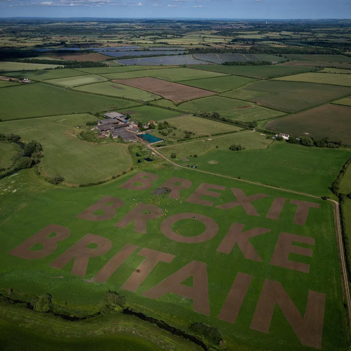 Activists and political campaign group Led By Donkeys mow a huge message into a farmer’s field for the 10-year anniversary of Brexit, near Cricklade, Wiltshire, Britain, on June 19, 2026.