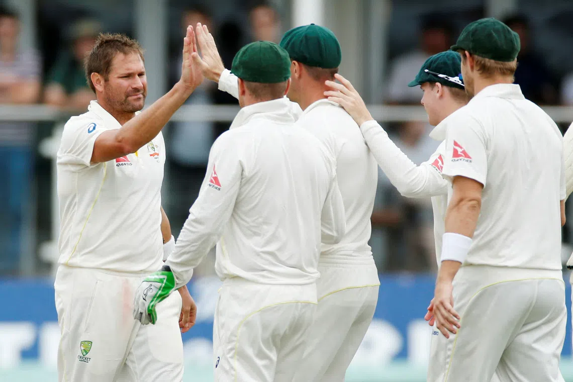 FILE PHOTO: Cricket - Kent v Australia - The Spitfire Ground, St Lawrence - 28/6/15   Australia's Ryan Harris celebrates with team mates after taking the wicket of Kent's Sam Billings   Action Images via Reuters / John Sibley   Livepic/File Photo